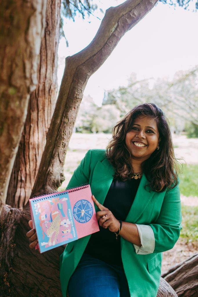 Nisha displays a wellbeing calendar, showing daily goals.