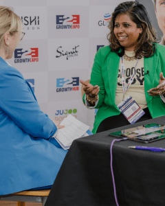 Nisha engaged in an active, warm dialogue during an onstage interview.